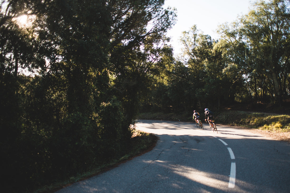 Intenergy Men's health: bicyclists exercising on roadway.